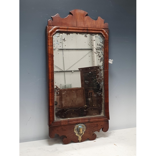 785 - An 18th Century walnut Girandole type Mirror with shaped surmount and with brass fitting, 22in H (R2... 