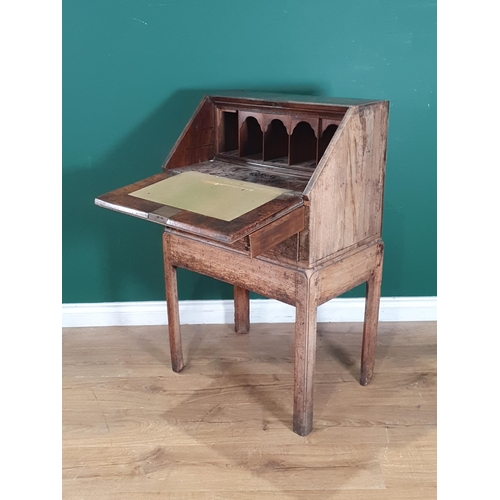 794 - A 19th Century walnut veneered Bureau on Stand, the fall front enclosing pigeon hole interior and gr... 