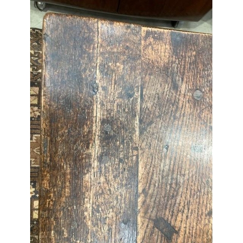 795 - An antique oak Side Table the three plank top raised on chamfered supports united by H stretcher, 2f... 