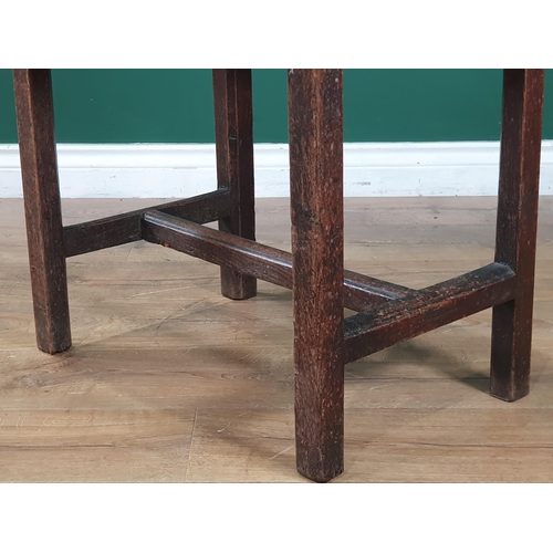 795 - An antique oak Side Table the three plank top raised on chamfered supports united by H stretcher, 2f... 