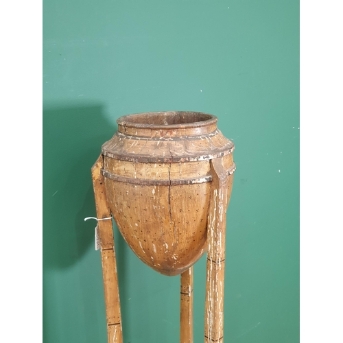 796 - A 19th Century painted faux bamboo two tier Plant Stand the top in the form of an Acorn, raised on s... 