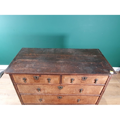 797 - An 18th Century oak and walnut veneered Chest of two short, three long graduated Drawers raised on b... 