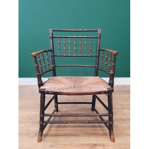 799 - A 19th Century Sussex Type painted faux bamboo Elbow Chair with rush seat. (R2)