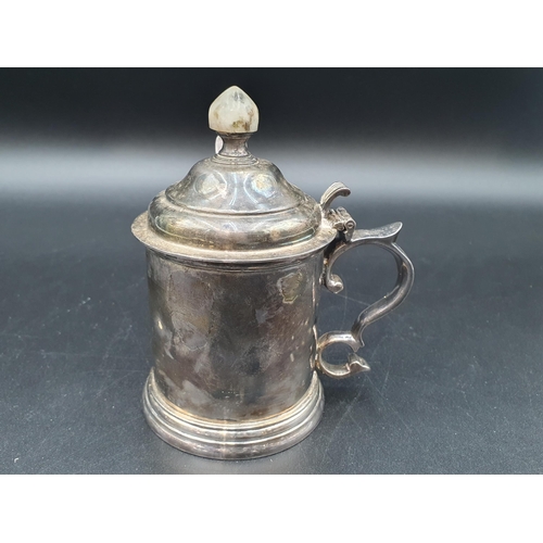 8 - An Elizabeth II heavy silver Drum Mustard Pot with domed lid having hardstone finial, volute thumb p... 