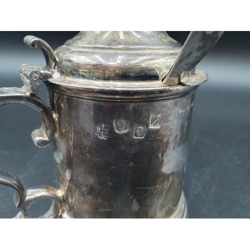 8 - An Elizabeth II heavy silver Drum Mustard Pot with domed lid having hardstone finial, volute thumb p... 