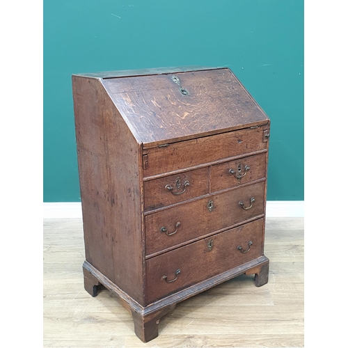 800 - An 18th Century and later oak Bureau of small proportions, the fall front enclosing four fitted draw... 