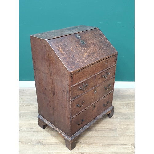 800 - An 18th Century and later oak Bureau of small proportions, the fall front enclosing four fitted draw... 