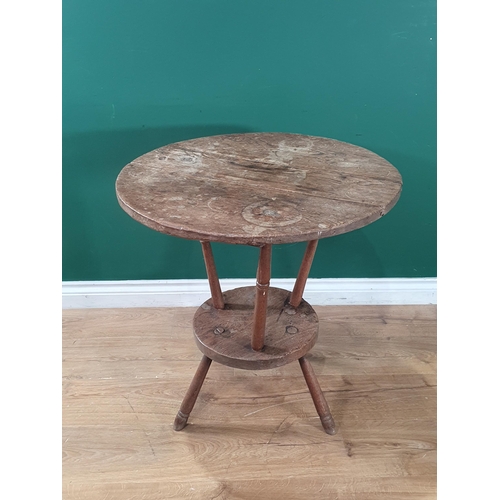 801 - An antique primitive oak circular two tier Lace Makers Table, raised on turned supports, 2ft 3