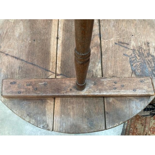 801 - An antique primitive oak circular two tier Lace Makers Table, raised on turned supports, 2ft 3