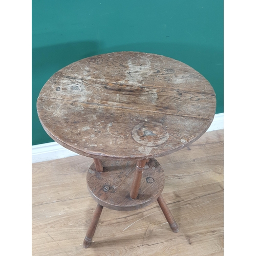 801 - An antique primitive oak circular two tier Lace Makers Table, raised on turned supports, 2ft 3