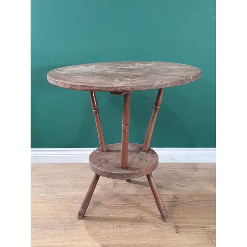 801 - An antique primitive oak circular two tier Lace Makers Table, raised on turned supports, 2ft 3