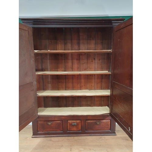 802 - A large antique oak Cupboard with a pair of panelled doors and with three drawers to the base, 6ft 1... 