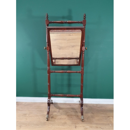 807 - A Regency mahogany Cheval Robing Mirror with turned uprights and on outswept supports with brass cap... 