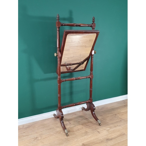 807 - A Regency mahogany Cheval Robing Mirror with turned uprights and on outswept supports with brass cap... 