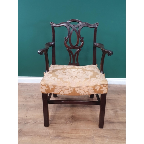 808 - A Georgian mahogany Elbow Chair with scrolled and pierced back splat, stuff-over seat on squared sup... 