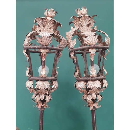 811 - A pair of blackamoor Figures holding lanterns with painted finish and standing on plinth, 6ft 8in H ... 