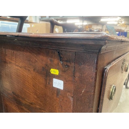 813 - An 18th Century oak Dresser Base with moulded top above three drawers and a shaped frieze on cabriol... 