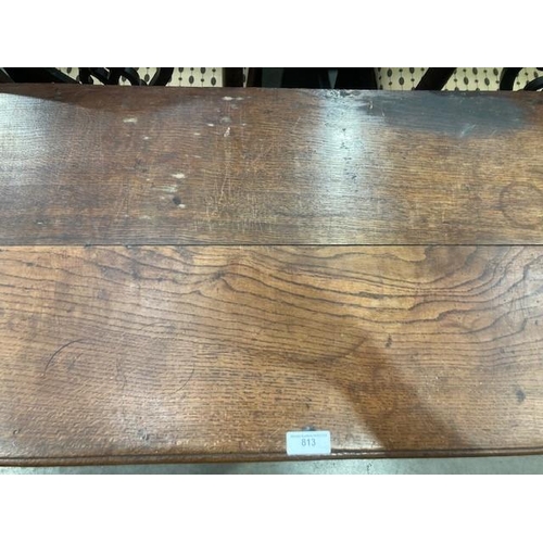 813 - An 18th Century oak Dresser Base with moulded top above three drawers and a shaped frieze on cabriol... 