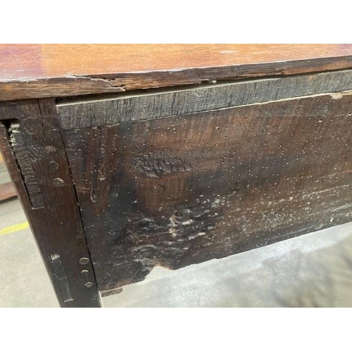 813 - An 18th Century oak Dresser Base with moulded top above three drawers and a shaped frieze on cabriol... 