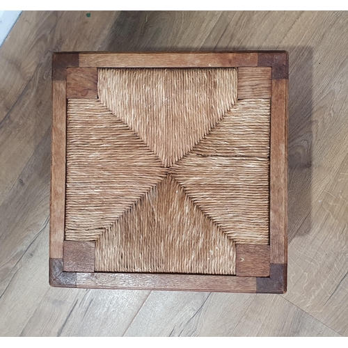 814 - A 20th Century pale oak square Stool with rush seat on stout baluster turned and square legs united ... 