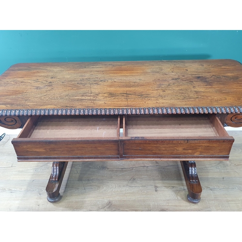 816 - A Regency rosewood Library Table with moulded edge, fitted two frieze drawers on cheval base, 5ft 3i... 