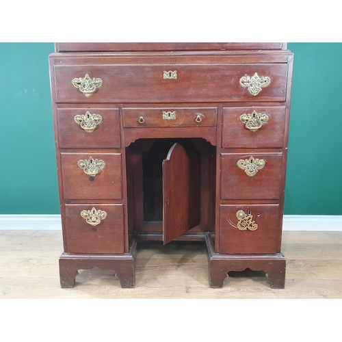 823 - A George III mahogany Chest on chest of unusual conformation fitted two short and three long drawers... 