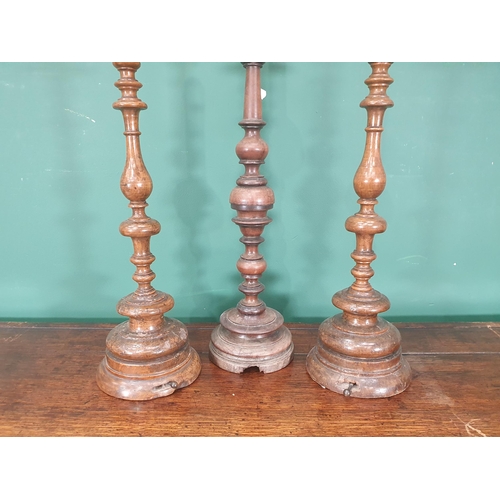 827 - A pair of walnut Table Lamps with baluster turned stems on circular bases, fitted electricity, and a... 