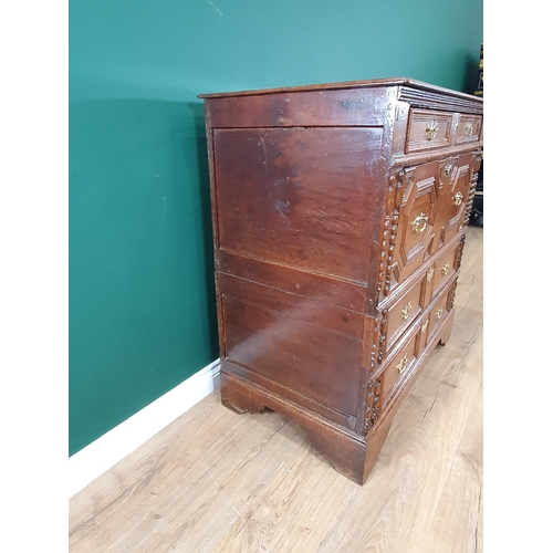 838 - An 18th Century oak Chest of four long drawers with moulded top above moulded drawer fronts on brack... 