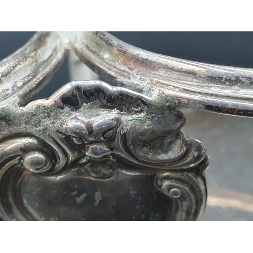 85 - A George II silver two bottle Stand with scroll handle and supports, vacant cartouche, London 1746, ... 