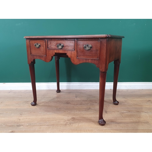 855 - A George II mahogany Lowboy with moulded top with re-entrant corners fitted three frieze drawers rai... 