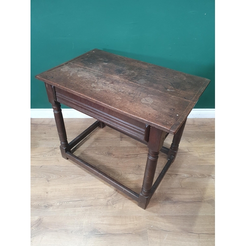 857 - A 17th Century oak Side Table with cleated two plank top fitted single frieze drawer with applied mo... 