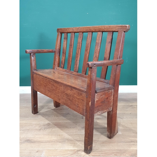 858 - An 18th Century Welsh elm and oak child's Bench with lath back and plank seat raised on squared supp... 