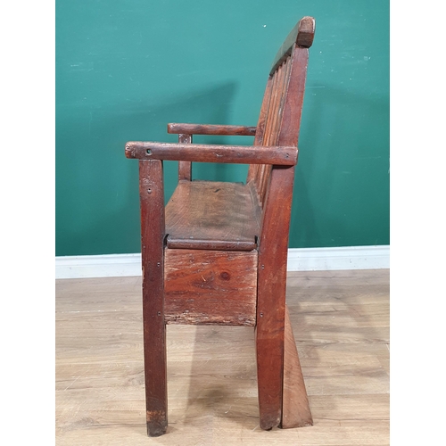 858 - An 18th Century Welsh elm and oak child's Bench with lath back and plank seat raised on squared supp... 