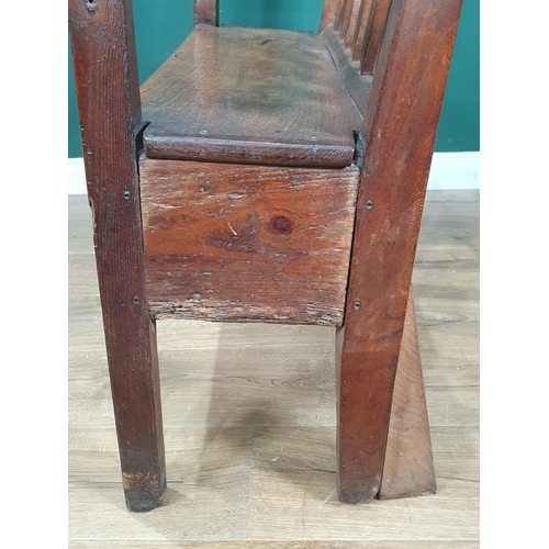 858 - An 18th Century Welsh elm and oak child's Bench with lath back and plank seat raised on squared supp... 