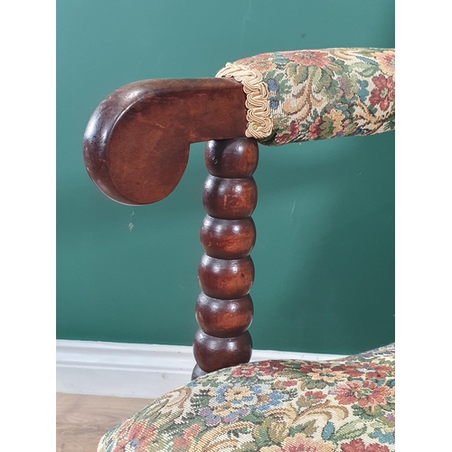 860 - A 19th Century bobbin turned Armchair with upholstered back and seat and raised bobbin turned front ... 