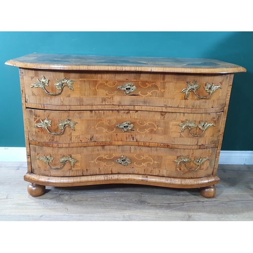 862 - A 19th Century German walnut and marquetry serpentine Chest of three long drawers, the crossbanded t... 