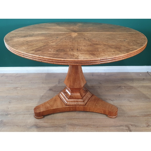 863 - A 19th Century Continental walnut circular Table and six Chairs, the segmented table top supported o... 