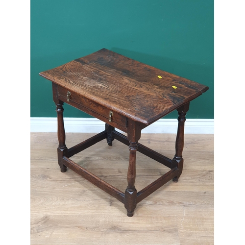 864 - An 18th Century oak Side Table fitted frieze drawer on baluster turned supports and squared stretche... 