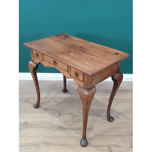 866 - A Georgian mahogany Side Table with quarter veneered and feather banded top, fitted three drawers on... 