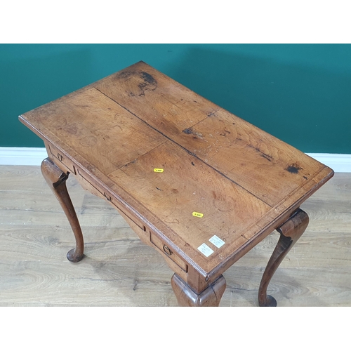 866 - A Georgian mahogany Side Table with quarter veneered and feather banded top, fitted three drawers on... 