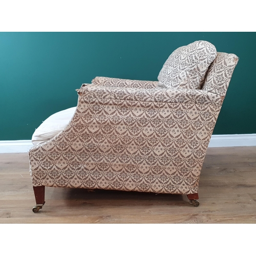 878 - A Howard and Sons Armchair in 'H & S' monogrammed ticking, raised on square tapered supports and cas... 