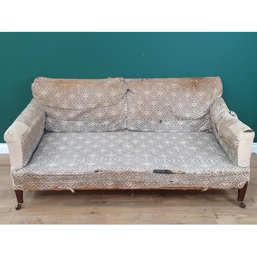 879 - A Howard and Sons two-seater Sofa with some 'H & S' monogrammed ticking, raised on square tapered fr... 