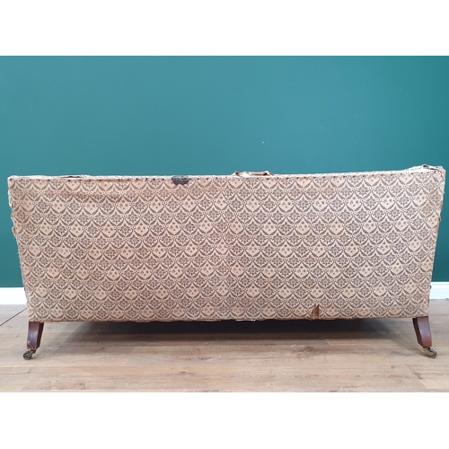 879 - A Howard and Sons two-seater Sofa with some 'H & S' monogrammed ticking, raised on square tapered fr... 