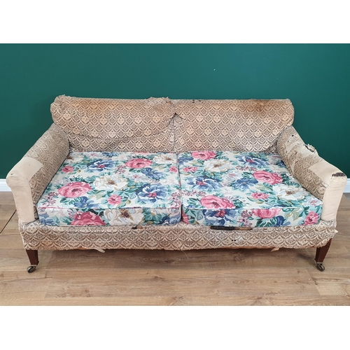 879 - A Howard and Sons two-seater Sofa with some 'H & S' monogrammed ticking, raised on square tapered fr... 