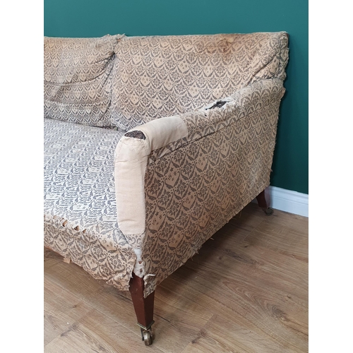 879 - A Howard and Sons two-seater Sofa with some 'H & S' monogrammed ticking, raised on square tapered fr... 