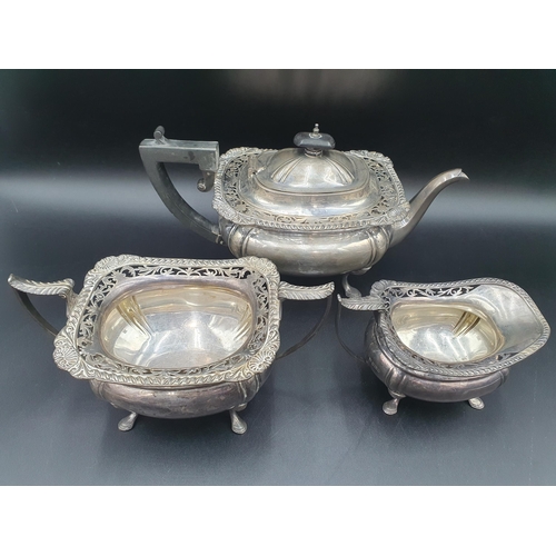 88 - A George V silver three piece Tea Service of boat shape with gadroon and pierced rims raised on shap... 