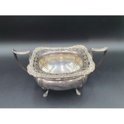 88 - A George V silver three piece Tea Service of boat shape with gadroon and pierced rims raised on shap... 