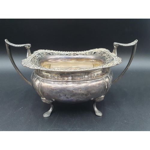 88 - A George V silver three piece Tea Service of boat shape with gadroon and pierced rims raised on shap... 