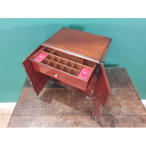 884 - A 19th Century mahogany Sewing Cabinet fitted a pair of cupboard doors enclosing a top drawer with c... 