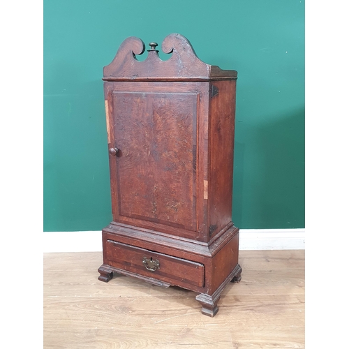 885 - An early 18th century oak Table Top Spice Cupboard, the broken pediment top above a single door encl... 